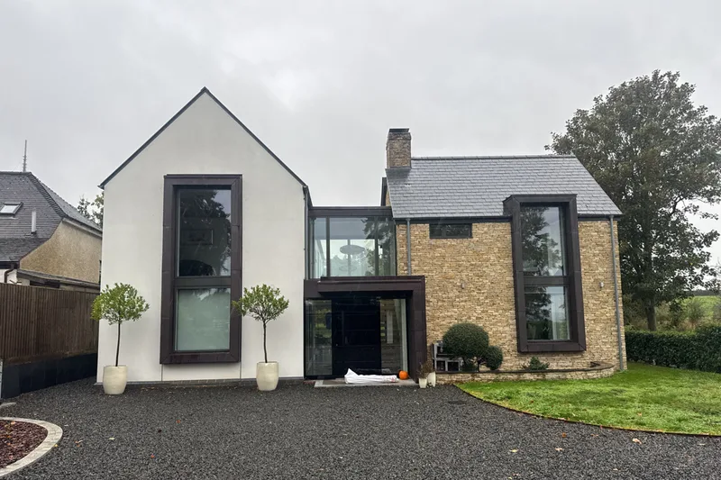 Contemporary stone and rendered home photographed during a completed Vertex survey