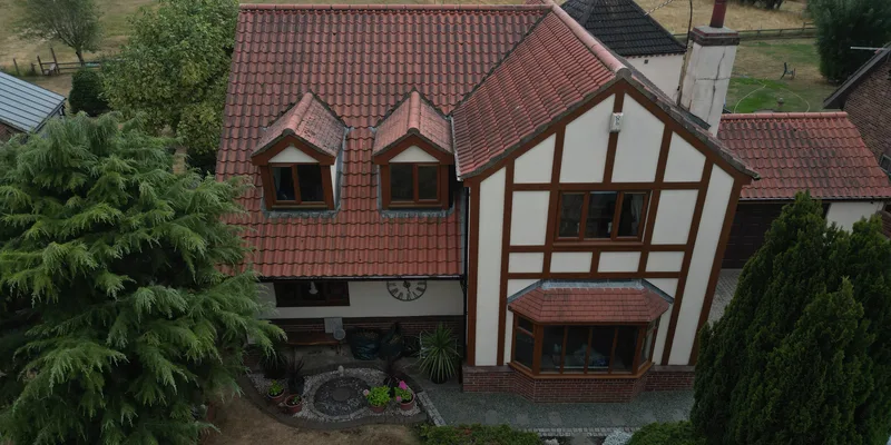 Unannotated aerial view of a tiled roof and house from a completed Vertex solar survey