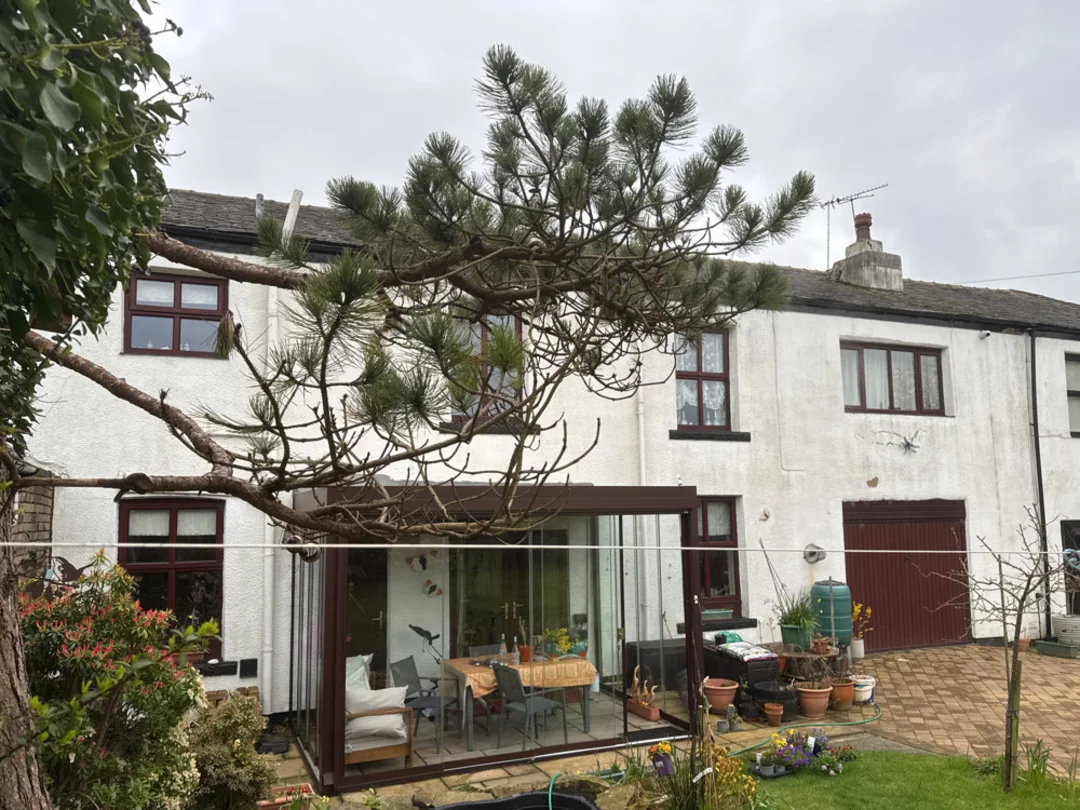 Rear elevation and conservatory at a pre-1900 Rochdale house surveyed by Vertex