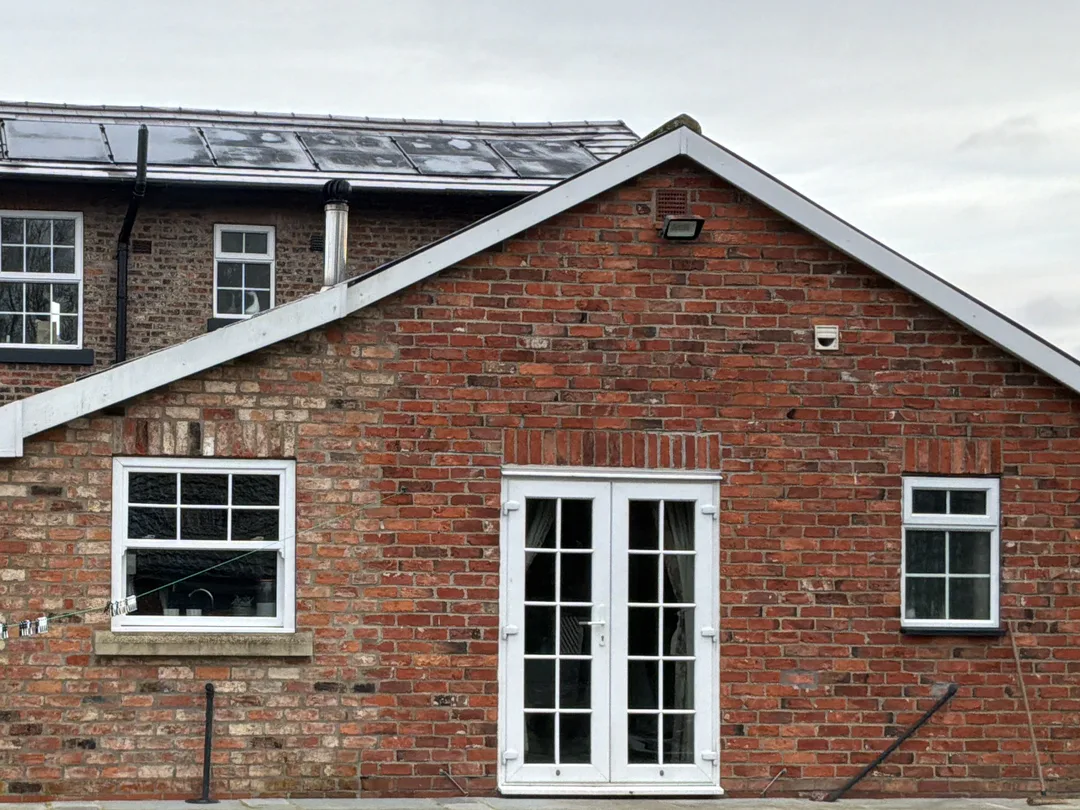 Later brick section behind a pre-1900 home surveyed by Vertex near Selby