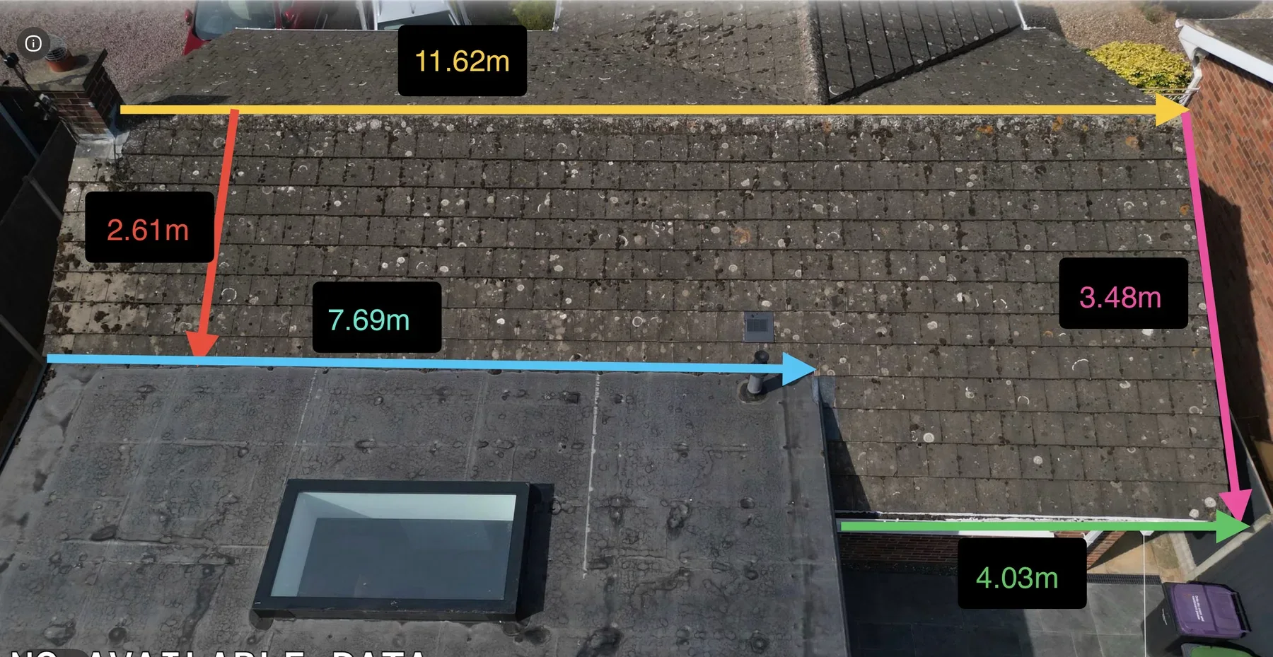 Annotated aerial photograph showing dimensions around a pitched roof beside two flat roof sections
